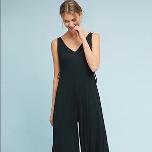 Black ribbed jersey jumpsuit with side ties